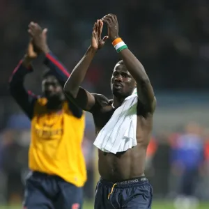 Emmanuel Eboue salutes the Arsenal fans after the match