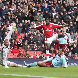 Emmanuel Eboue shoots past Burnley goalkeeper Brian