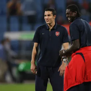 Emmauel Adebayor and Robin van Persie (Arsenal) share a joke