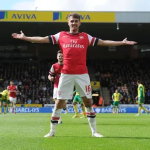 Euphoria Unleashed: Aaron Ramsey's Thrilling Goal Celebration vs. Norwich City, Premier League 2013-14