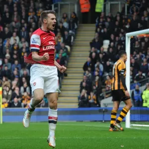 Euphoria Unleashed: Aaron Ramsey's Thrilling Goal Celebration vs. Hull City, Premier League 2013-2014