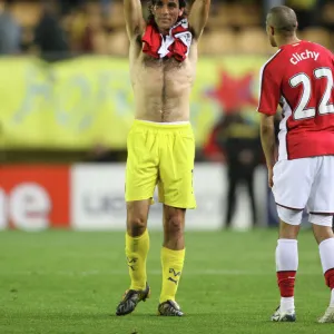 ex Arsenal player Robert Pires waves to the fans after the match