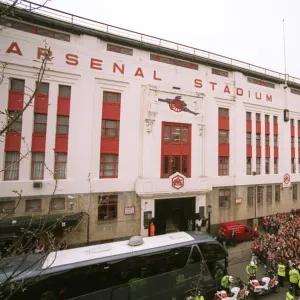 Fans gather outside the East Stand on Avenell Road to watch the Arsenal team entre the stadium