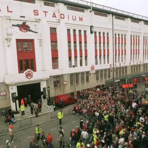 Fans gather outside the East Stand on Avenell Road to watch the Arsenal team arrive at the stadium