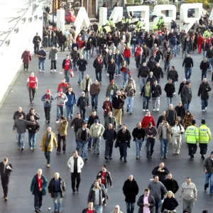 Fans use the Clock End Bridge to get to the stadium