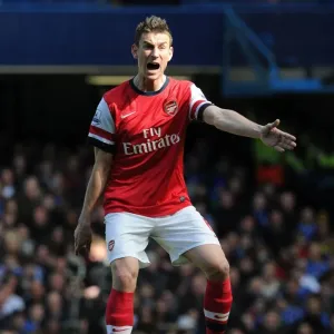 Focused Koscielny Amidst the Intense Chelsea-Arsenal Rivalry (2013-14) Focused Koscielny Amidst the Intense Chelsea-Arsenal Rivalry (2013-14)