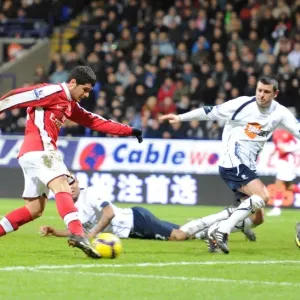 Fran Merida shoots past Bolton goalkeeper Jussi Jskelainen to score the 2nd Arsenal goal