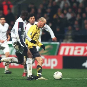 Freddie Ljungberg breaks past Bolton defender Abdoulaye Meite to score the 2nd Arsenal goal