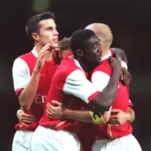 Freddie Ljungberg is congratulated on scoring Arsenal s