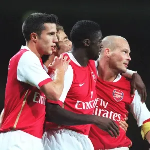 Freddie Ljungberg is congratulated on scoring Arsenal s