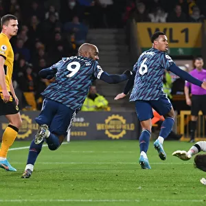Gabriel and Lacazette Celebrate Arsenal's Goal Against Wolverhampton Wanderers in Premier League Match
