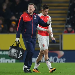 Gabriel Receives Medical Attention from Arsenal Physio Colin Lewin during FA Cup Match against Hull City Gabriel Receives Medical Attention from Arsenal Physio Colin Lewin during FA Cup Match against Hull City