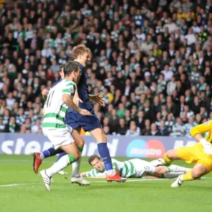Gary Cladwell puts the ball past Celtic goalkeeper Gary Cladwell puts the ball past Celtic goalkeeper
