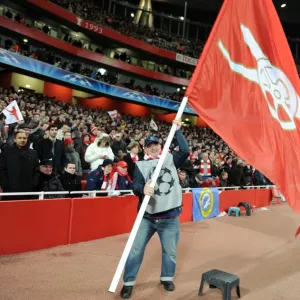 Giant flags are waved pitchside during half time. Arsenal 2: 1 Barcelona