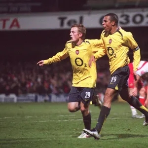 Gilberto celebrates scoring Arsenals 2nd goal with Sebastian Larsson