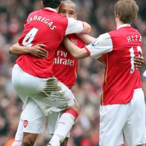 Gilberto celebrates scoring Arsenals 2nd goal with Cesc Fabregas and Alex Hleb