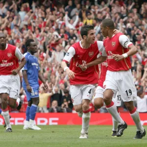 Gilberto celebrates scoring Arsenals goal with Cesc Fabregas