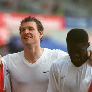 Gilberto, Jens Lehmann and Kolo Toure (Arsenal) celebrate winning the league