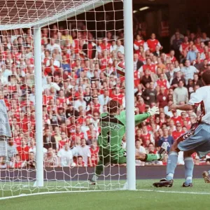 Gilberto scores past Thomas Sorensen Print Gilberto scores past Thomas Sorensen Print