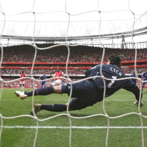 Gilberto shoots past Chelsea goalkeeper Petr Cech to score the Arsenal from the penalty spot