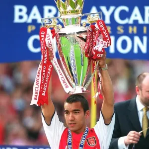 Giovanni van Bronckhorst lifts the F. A. Barclaycard Premiership Trophy Giovanni van Bronckhorst lifts the F. A. Barclaycard Premiership Trophy