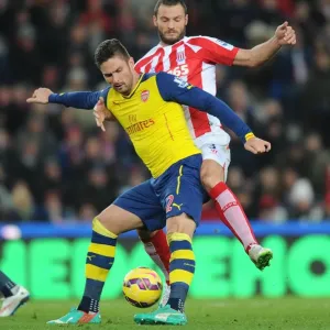 Giroud vs Pieters: A Strategic Face-Off at Britannia Stadium - Arsenal vs Stoke City, Premier League 2014-15 Giroud vs Pieters: A Strategic Face-Off at Britannia Stadium - Arsenal vs Stoke City, Premier League 2014-15