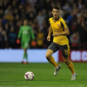 Granit Xhaka in Action: Arsenal's Midfield Maestro Shines Against Nottingham Forest in EFL Cup (2016-17)
