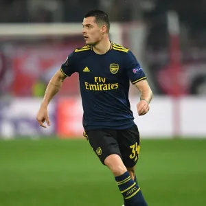 Granit Xhaka in Action: Olympiacos vs. Arsenal, UEFA Europa League Round of 32 (Piraeus, 2020) Granit Xhaka in Action: Olympiacos vs. Arsenal, UEFA Europa League Round of 32 (Piraeus, 2020)