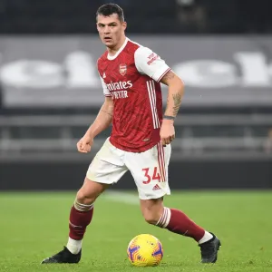 Granit Xhaka of Arsenal in Action at Tottenham Hotspur Stadium during the 2020-21 Premier League Match Granit Xhaka of Arsenal in Action at Tottenham Hotspur Stadium during the 2020-21 Premier League Match