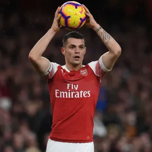 Granit Xhaka: Arsenal's Midfield Maestro in Action Against Huddersfield Town, Premier League 2018-19 Granit Xhaka: Arsenal's Midfield Maestro in Action Against Huddersfield Town, Premier League 2018-19