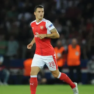 Granit Xhaka: Arsenal's Midfield Maestro in Action against Paris Saint-Germain, UEFA Champions League 2016-17