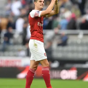 Granit Xhaka Celebrates with Arsenal Fans after Newcastle United Victory