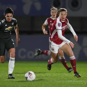 Great attempt! Here are a few alternative title suggestions for the image: 1. FA WSL Rivalry: Malin Gut vs Jess Sigsworth - Arsenal Women vs Manchester United Women in Empty Stands 2. Empty Meadow Park: Malin Gut and Jess Sigsworth Battle it Out in the FA Great attempt! Here are a few alternative title suggestions for the image: 1. FA WSL Rivalry: Malin Gut vs Jess Sigsworth - Arsenal Women vs Manchester United Women in Empty Stands 2. Empty Meadow Park: Malin Gut and Jess Sigsworth Battle it Out in the FA