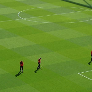 The groudstaff work on the pitch before the match. Arsenal 2: 0 West Bromwich Albion