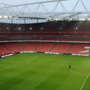 The Groundsman Prepares the Emirates Pitch for Arsenal's 2:0 Quarterfinal Victory over Wigan Athletic