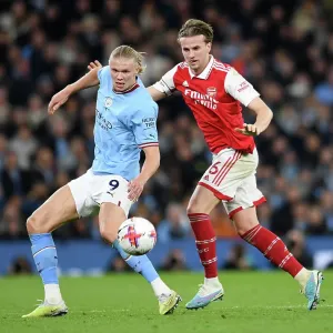Haaland vs. Holding: Battle for Possession in Manchester City vs. Arsenal Premier League Clash (2022-23) Haaland vs. Holding: Battle for Possession in Manchester City vs. Arsenal Premier League Clash (2022-23)