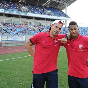 HANOI, VIETNAM - JULY 17: Lukas Podolski and Serge Gnabry of Arsenal before the international