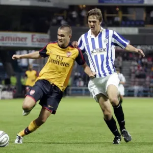 Henri Lansbury (Arsenal) Danny Codman (Huddersfield) Henri Lansbury (Arsenal) Danny Codman (Huddersfield)