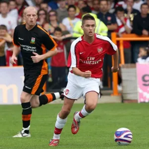 Henri Lansbury (Arsenal) Neal Bishop (Barnet) Henri Lansbury (Arsenal) Neal Bishop (Barnet)