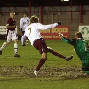 Henri Lansbury scores his and Arsenals 1st goal past Daniel MacDonald (Burnley) Henri Lansbury scores his and Arsenals 1st goal past Daniel MacDonald (Burnley)