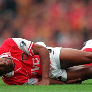 Ian Wright (Arsenal) on the floor injured