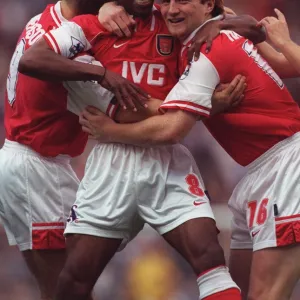 Ian Wright celebrates scoring for Arsenal with John Hartson and Paul Merson