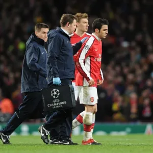 Injured Arsenal captain Cesc Fabregas limps off the pitch. Arsenal 2: 2 Barcelona