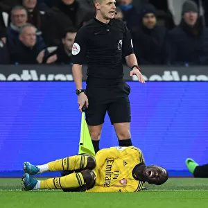 Injured Nicolas Pepe: A Moment of Agony in West Ham United vs Arsenal FC, Premier League
