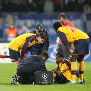 Injured Theo Walcott is treated by Arsenal physio Colin Lewin