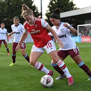 Intense Battle: Arsenal Women vs West Ham United at Meadow Park