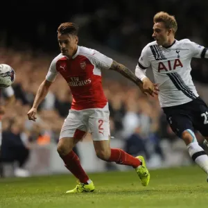 Intense Battle: Debuchy vs. Eriksen in the Capital One Cup Clash Between Tottenham and Arsenal Intense Battle: Debuchy vs. Eriksen in the Capital One Cup Clash Between Tottenham and Arsenal
