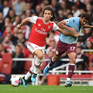 Intense Battle: Guendouzi vs Trezeguet in Arsenal vs Aston Villa Premier League Clash (September 2019)