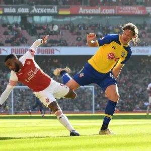Intense Battle: Lacazette vs. Vestergaard in Arsenal vs. Southampton Showdown Intense Battle: Lacazette vs. Vestergaard in Arsenal vs. Southampton Showdown