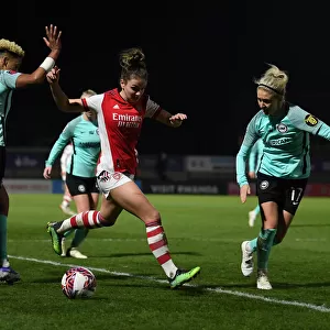 Intense Battle: Laura Wienroither of Arsenal vs Brighton's Defense at Meadow Park, FA WSL